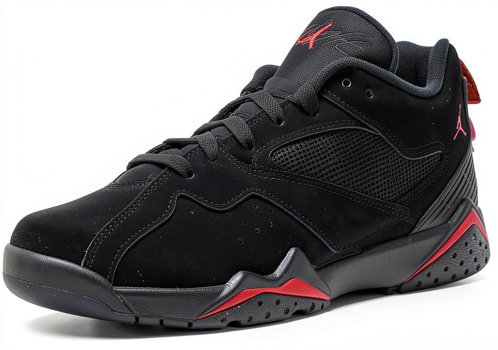 Nike boys running shoes in black, gym red, and anthracite colors on a neutral background