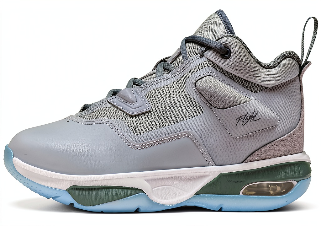 Installing Nike Boys Basketball Shoes Wolf Grey Cool Grey White on a wooden desk